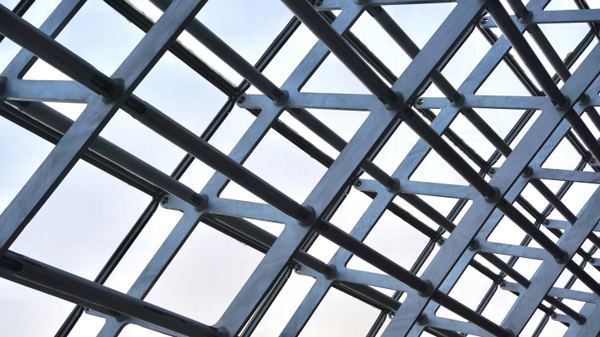 Steel and glass curtain wall framing viewed from below